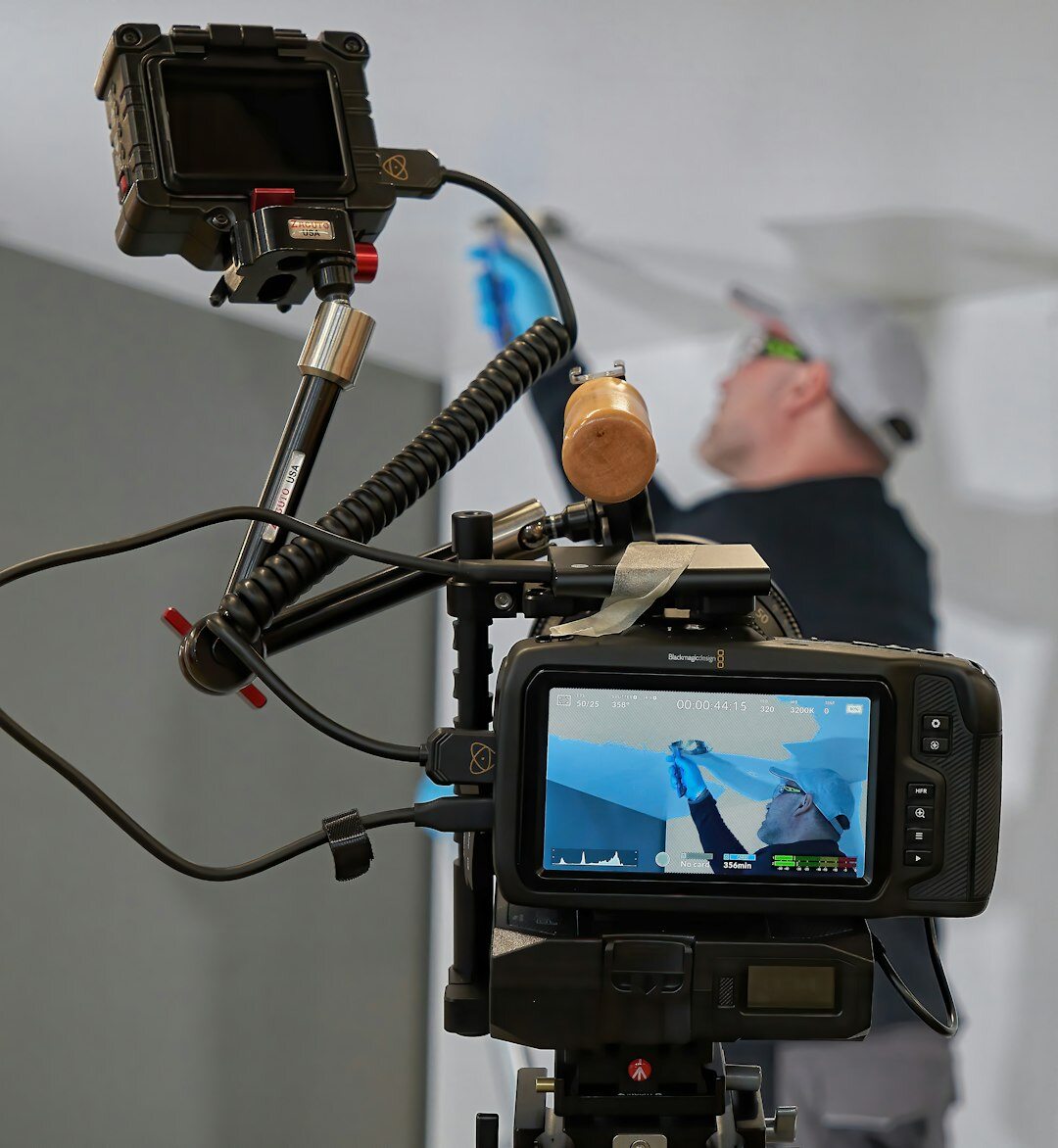 Woman filming a video capsule with a professional camera